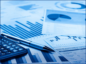 Financial paperwork and calculator on a surface