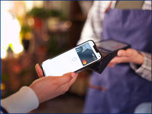 person using mobile phone to make a purchase