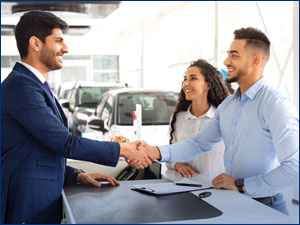 man shaking salesperson hand