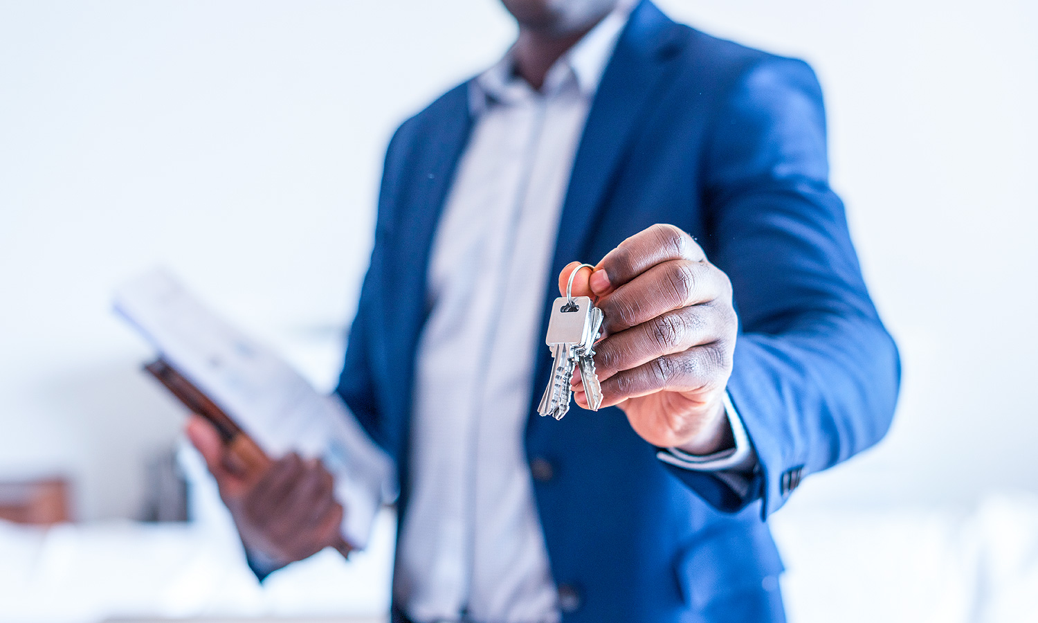 Person holding a set of keys