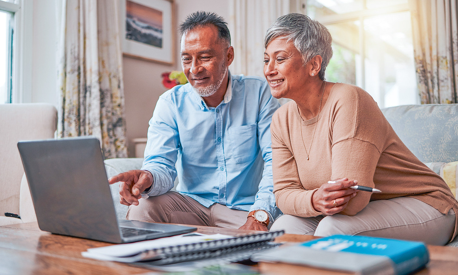 Couple looking at a laptop