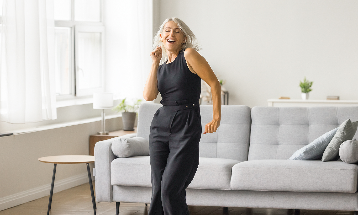 Woman dancing in a living room