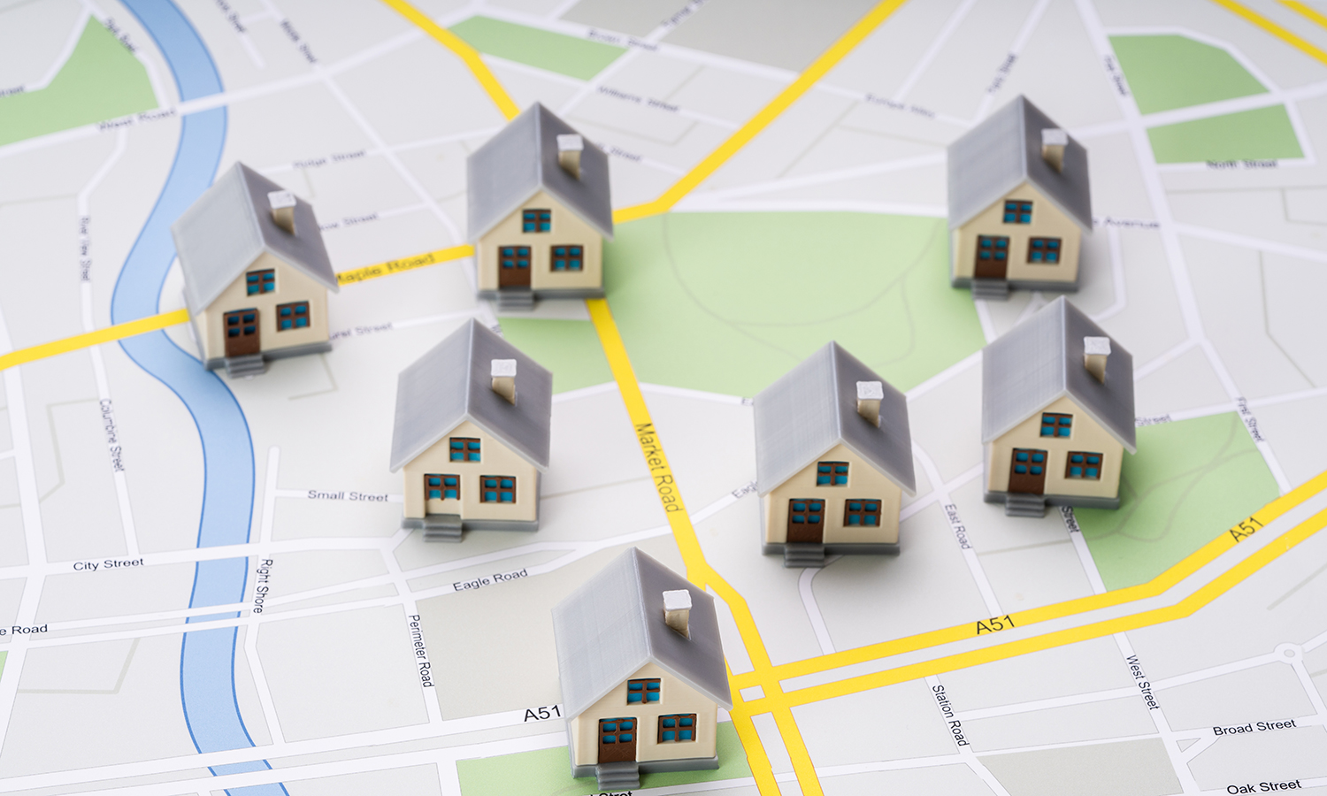 Tiny toy houses on a map