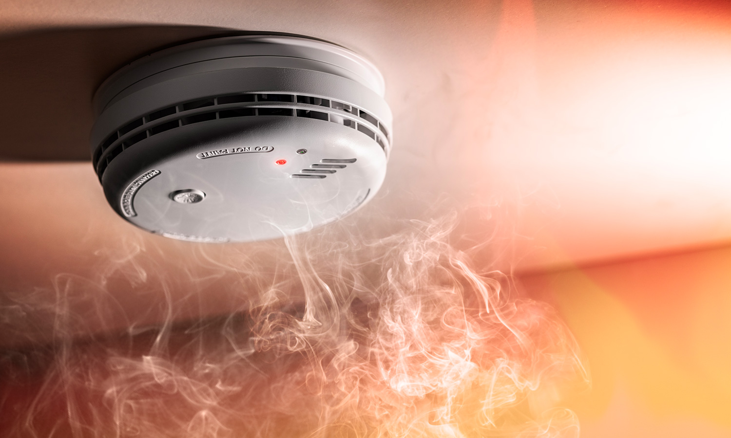 Smoking rising into a smoke detector