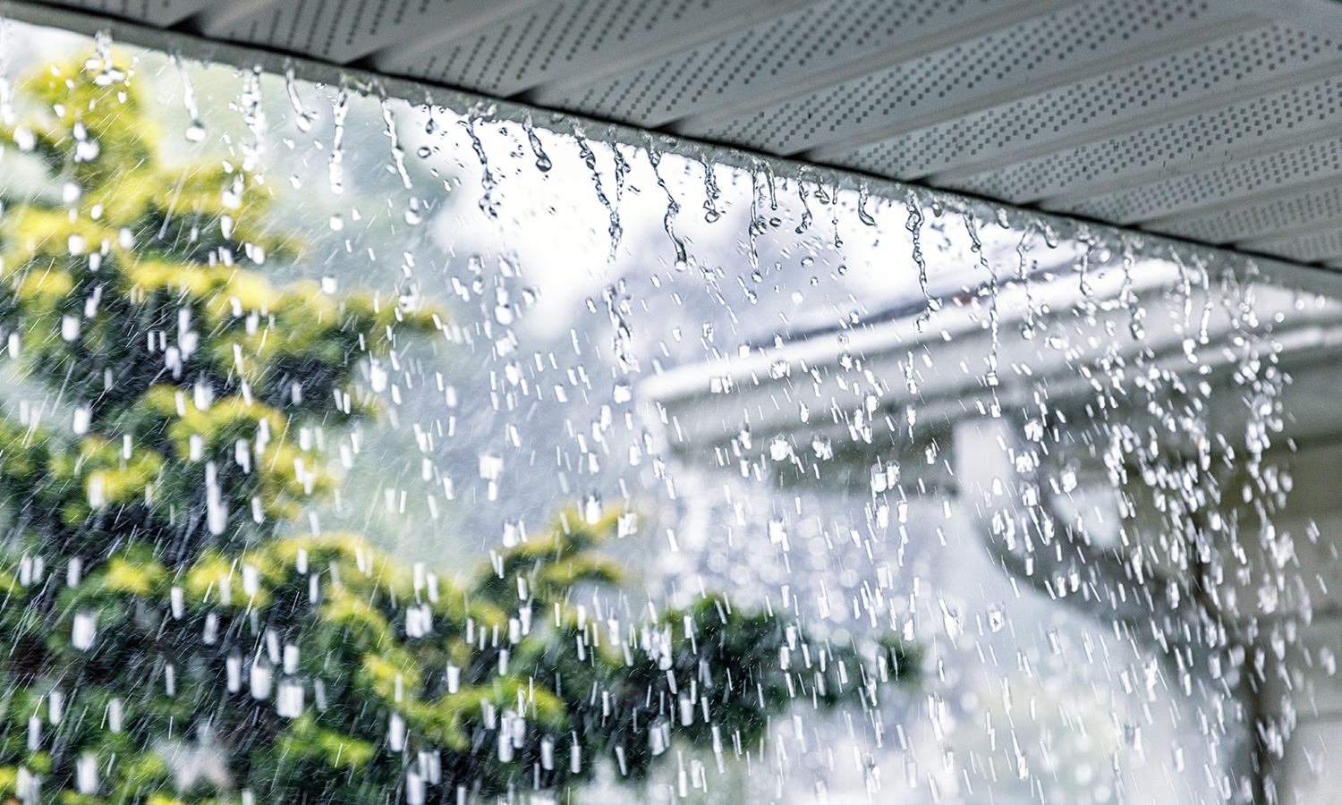 Rain falling off a roof.