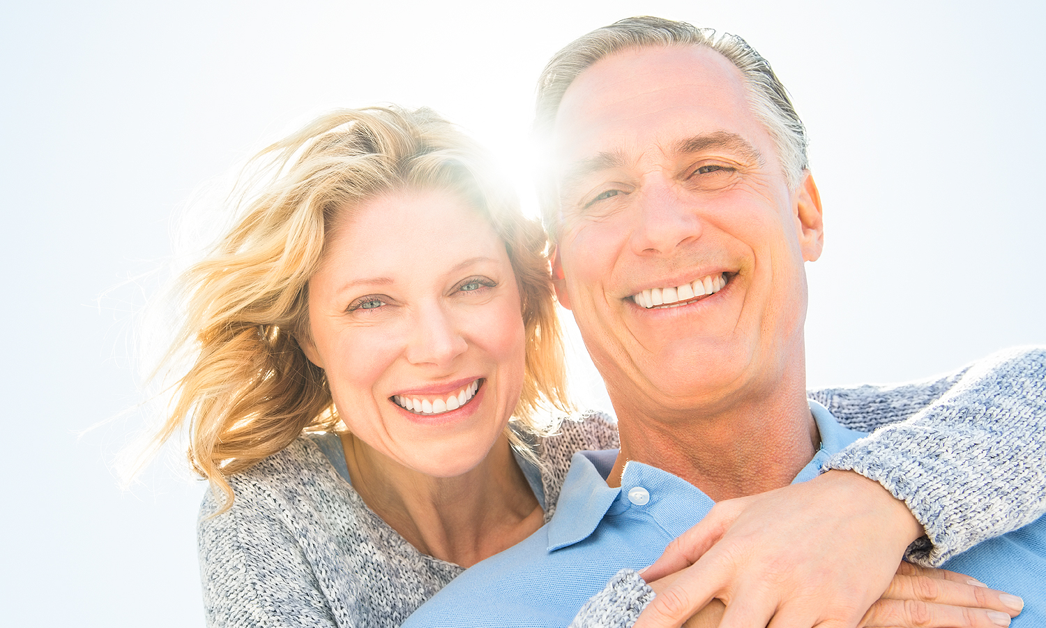 Older woman hugging older man