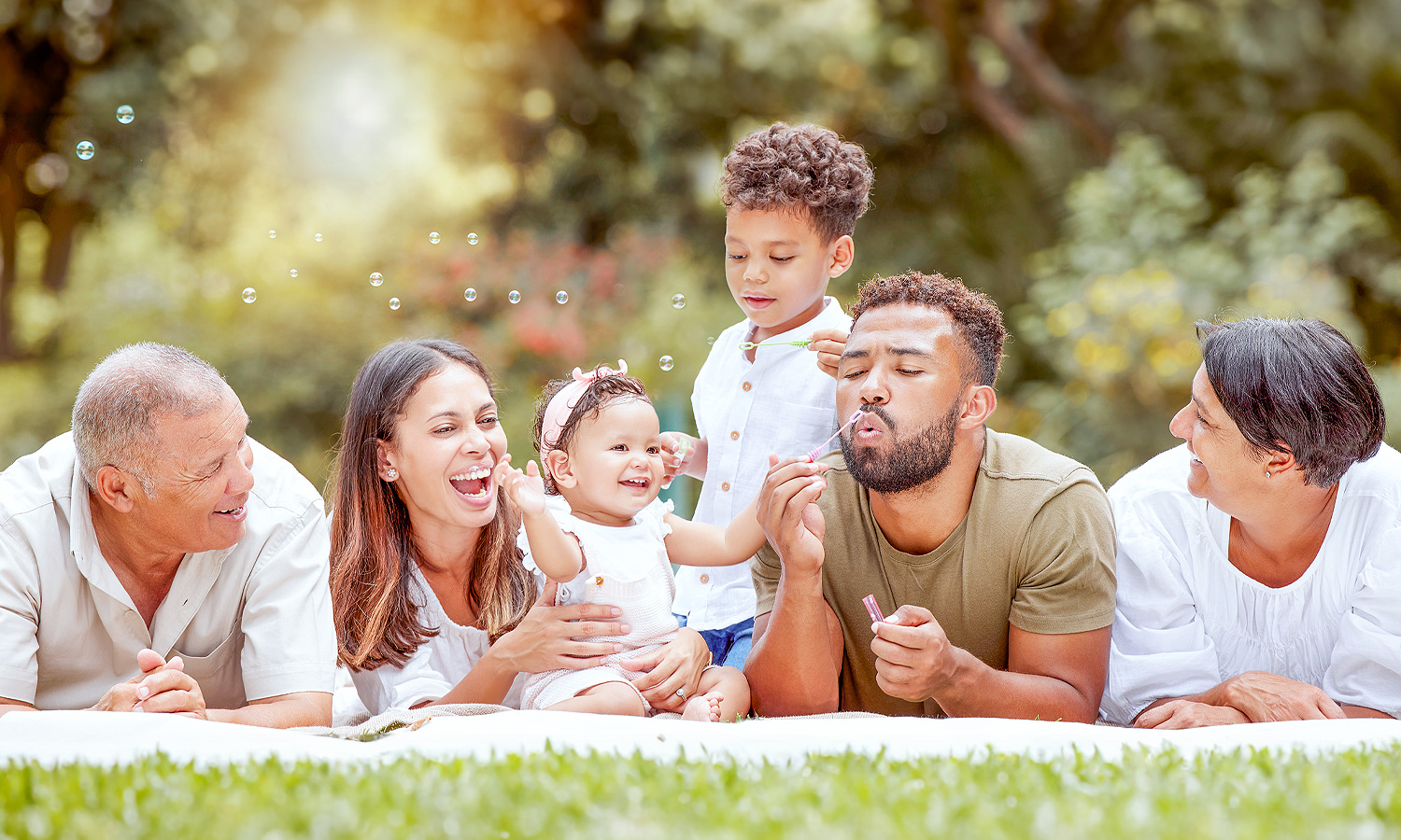 Family blowing bubbles.